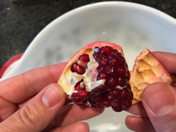 Opening a pomegranate