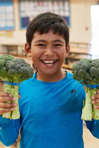 Kid with broccoli