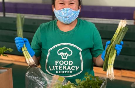 Staff packing veggie boxes