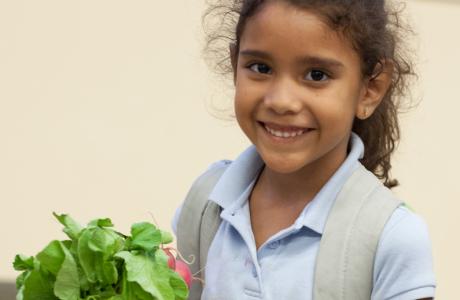 Student with radishes