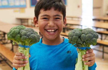 Kid with broccoli