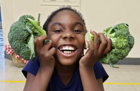 Kid with broccoli