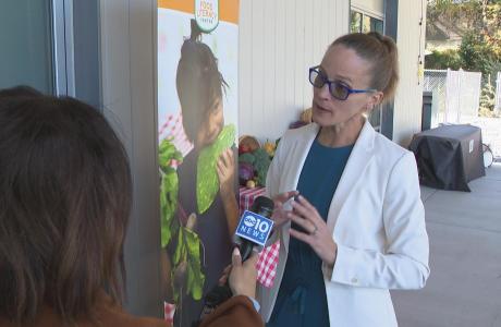 Executive Director Amber Stott speaking to press