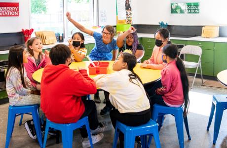 Amber with students in cooking classroom
