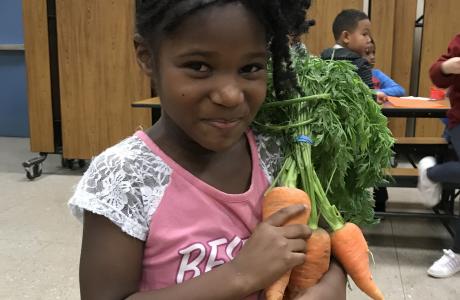 Student with carrots