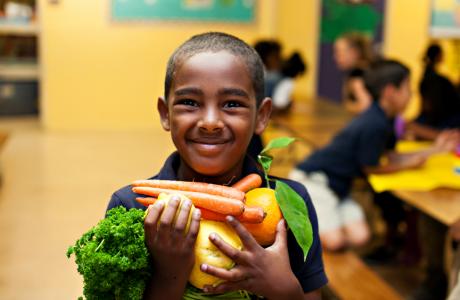 Student holding veggies