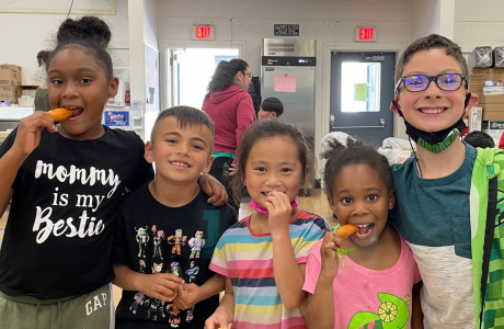 Students eating carrots