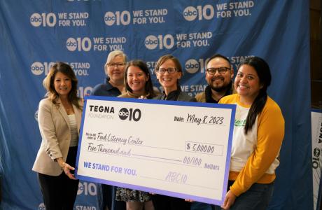 Food Literacy Center and ABC10 staff group photo behind  check. 
