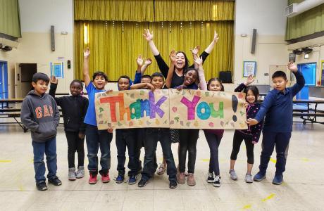 Group of kids holding thank you sign