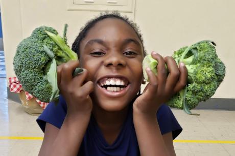 Kid with broccoli