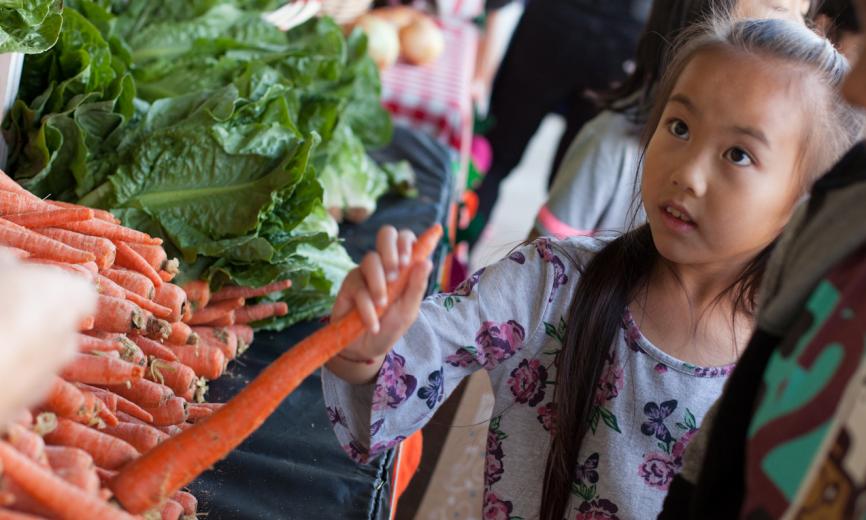 Student picking her carrots