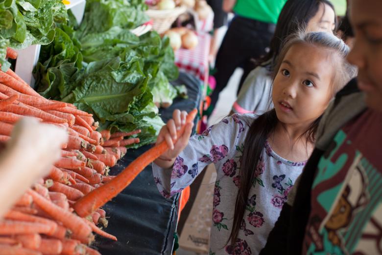 Kids shopping for carrots