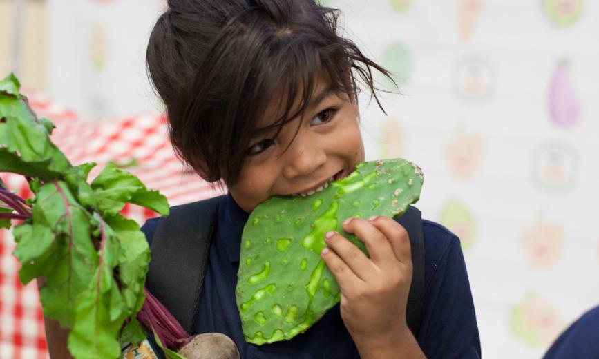 Kid eating nopales