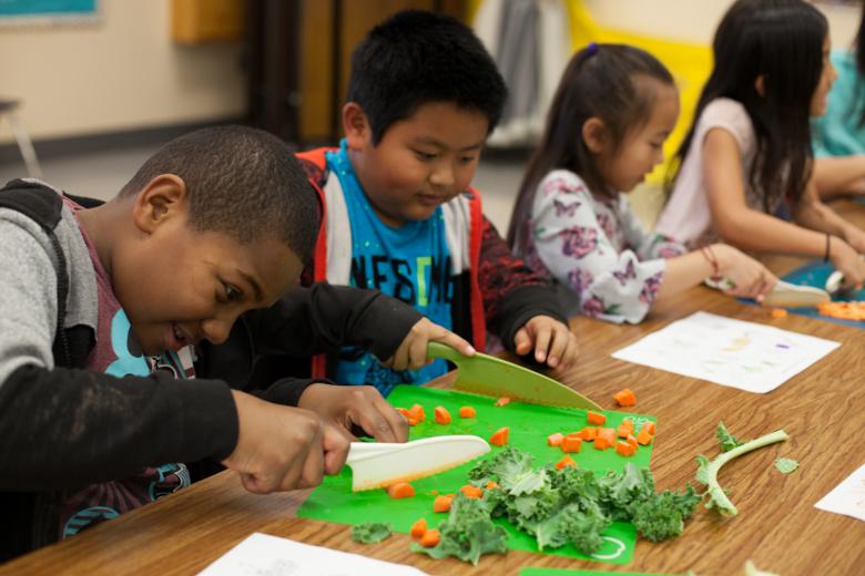Kids chopping veggies