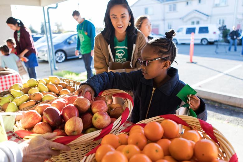 Student shopping the farmers market