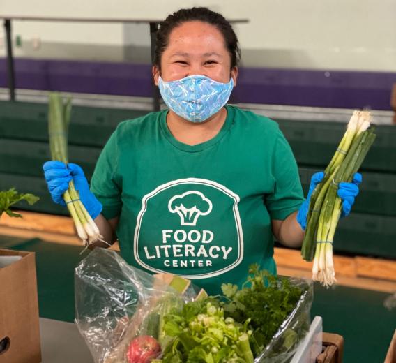 Staff packing veggie boxes