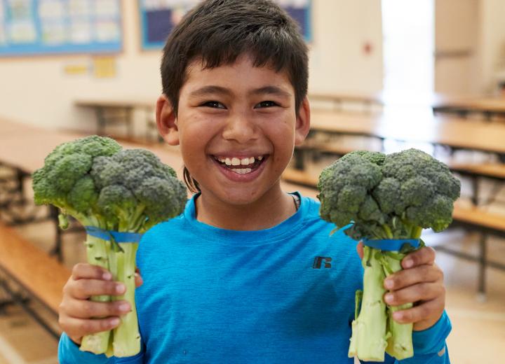 Kid with broccoli