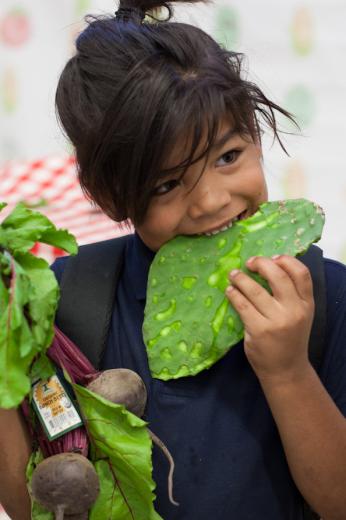 Kid eating cactus
