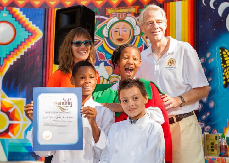 Roger Dickinson presented Capitol Heights Academy with their Food Literacy Hero Award
