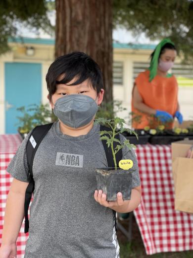 Kid with plant