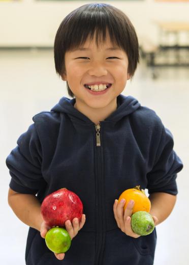 Kid with fruit