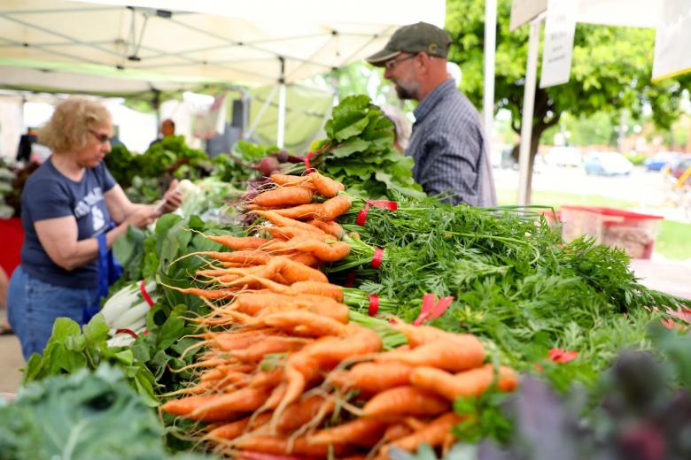 Photo of farm stand with carrots on the display