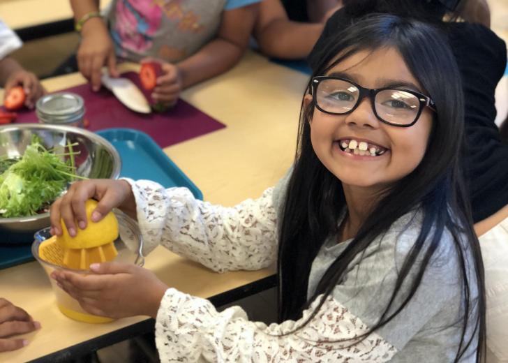 Girl juicing lemon