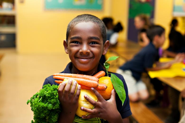 Student holding veggies