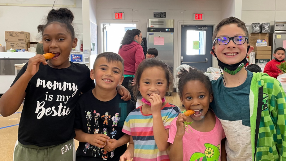 Students eating carrots