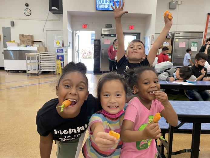 Kids eating carrots