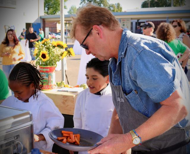 Rick Mahan with students at a fundraiser
